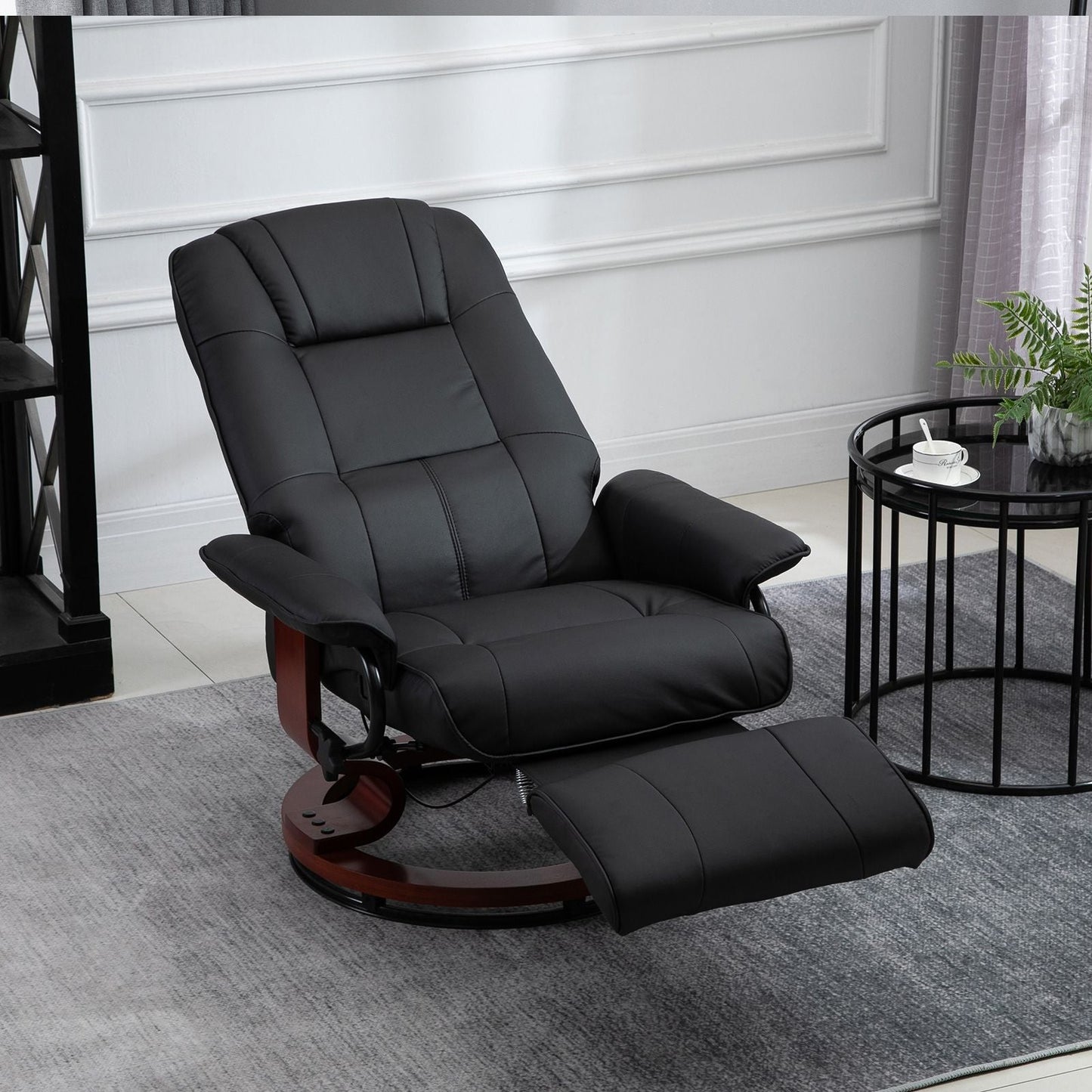 Living Room Relaxation: Black Faux Leather Swivel Recliner with Adjustable Footrest